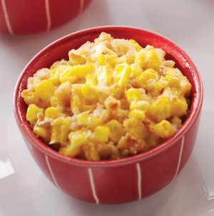 Creamed corn casserole in a red bowl