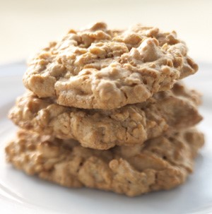 Stacked oatmeal cookies on a white plate