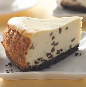 Slice of chocolate chip cheesecake on a white plate