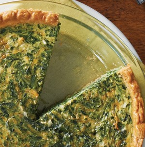 Baked quiche filled with spinach and onion