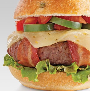 Bacon-wrapped burger topped with pepper jack cheese, jalapenos and tomatoes