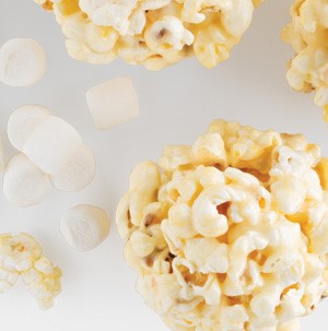 Popcorn balls with mini marshmallows on the side