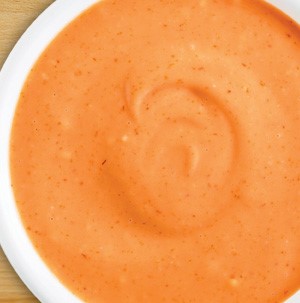 Bowl of spicy sriracha dipping sauce