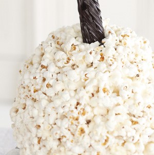 Black licorice attached to a white popcorn ball