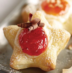 Star-shaped pastry topped with fruit jam and chocolate shavings