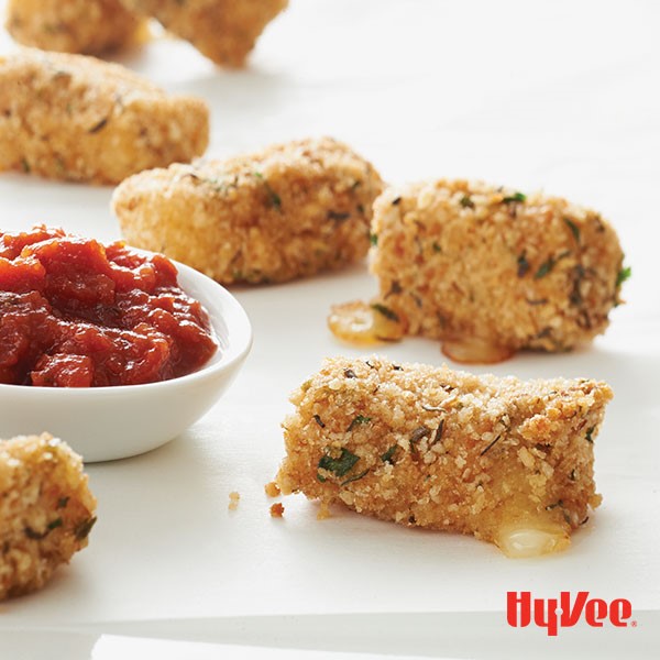 Breaded cheese poppers served with side of marinara sauce