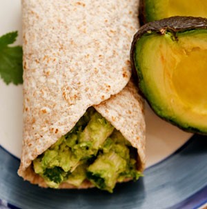 Plate filled with a chicken avocado salad wrap