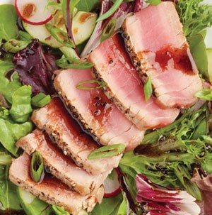Salad topped with ahi tuna steak