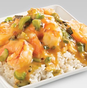 Rice topped with shrimp, celery, and sauce