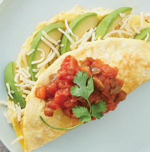 Avocado omelet topped with salsa and cilantro