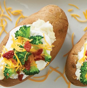 Russet potato filled topped with sour cream, broccoli florets, bacon, and shredded cheese