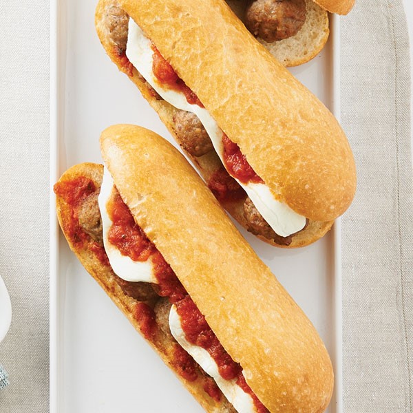Sub buns filled with meatballs, fresh mozzarella and red sauce