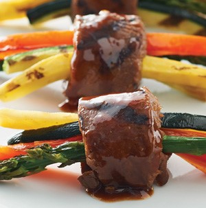 Thinly sliced carrots, zucchini, and summer squash inside grilled hoisin steak 