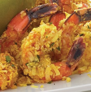 Plate of coconut curry shrimp with mango dipping sauce