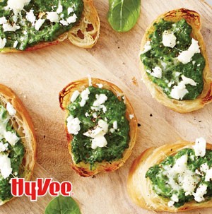 Thinly sliced mini croissants topped with spinach, feta cheese, pine nuts and parmesan