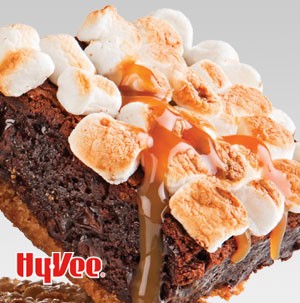 Brownies topped with toasted mini marshmallows and drizzled caramel