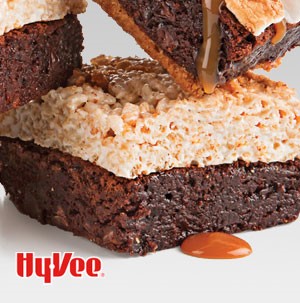 Fudgy brownies topped with rice crispy treas and drizzled in caramel sauce