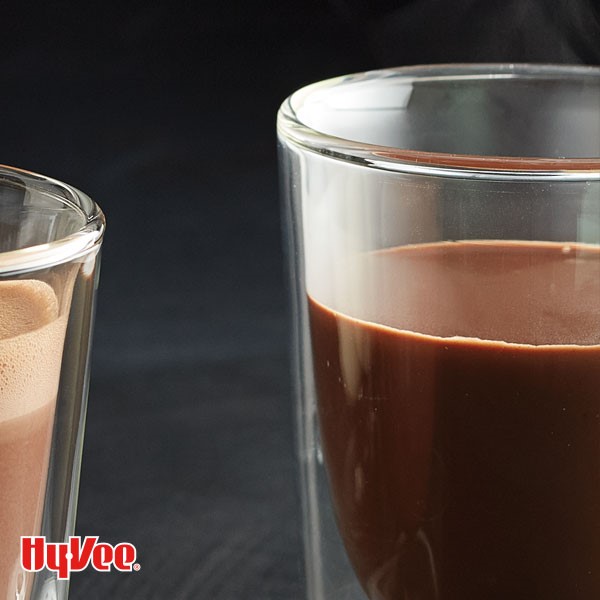 Glass filled with dark hot chocolate 