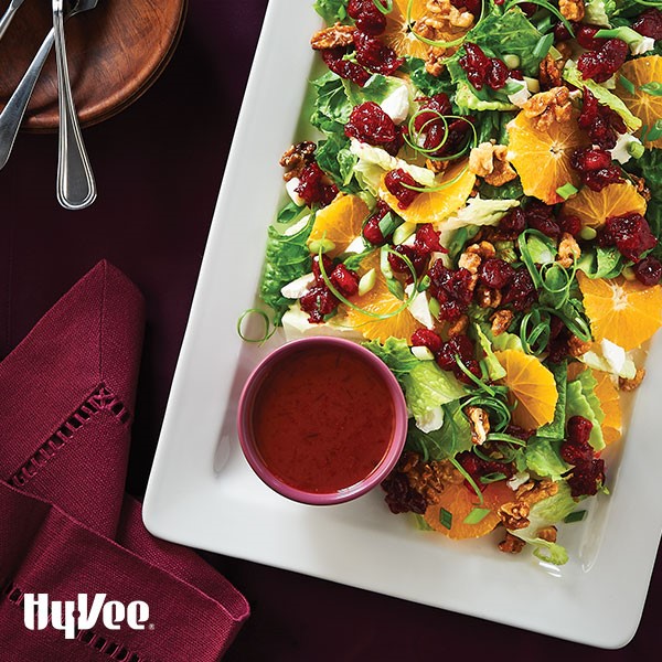 Plate of cranberry-citrus salad with candied walnuts