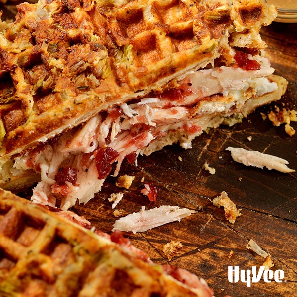 Cranberry turkey waffle sandwich on a wooden board