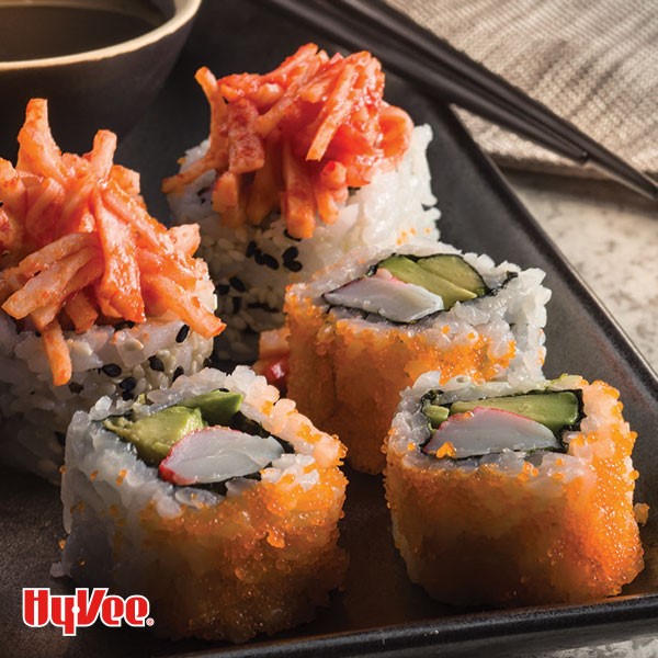 Assorted sushi on black serving tray