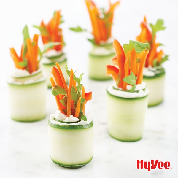 Cucumber roll ups filled with goat cheese, carrots, red bell pepper and fresh parsley