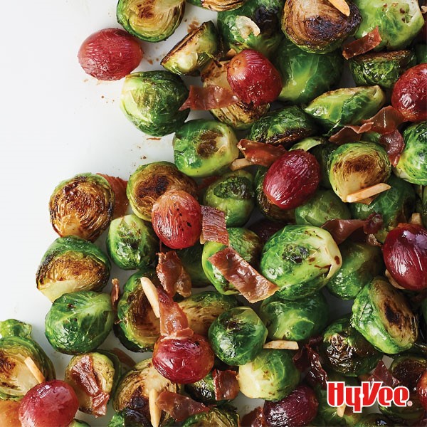 Roasted brussels sprouts with blistered tomatoes, slivered almonds, and crispy prosciutto 