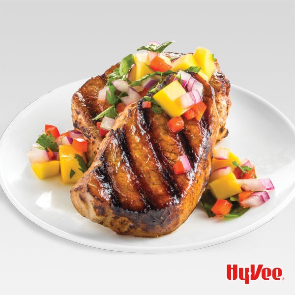 Plate of grilled pork topped with Caribbean mango mix