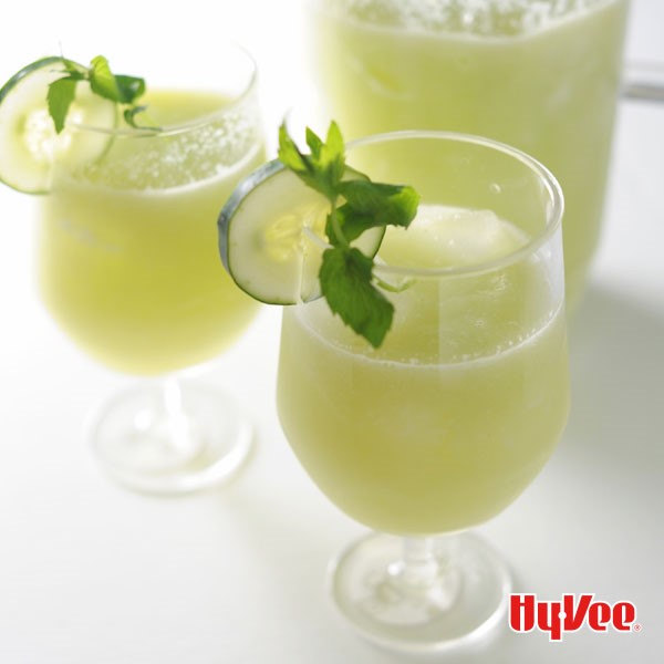 Glasses of cucumber mint lemonade, garnished with cucumber slices and fresh mint leaves