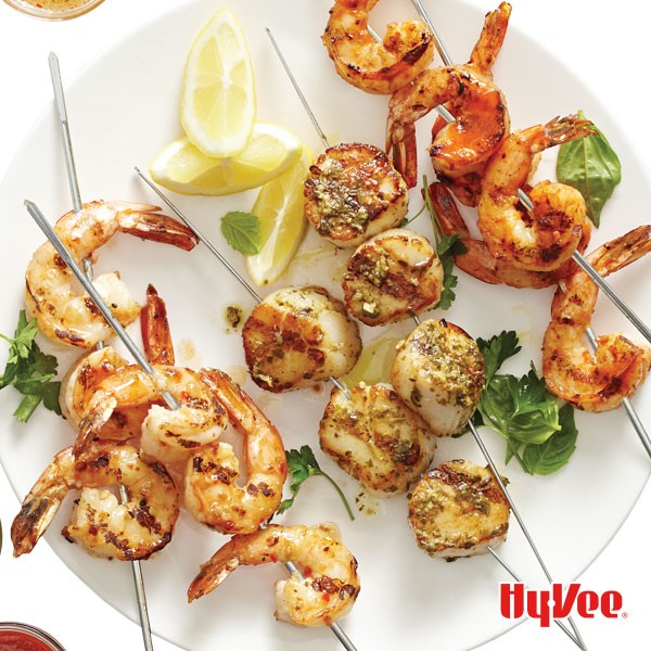 Grilled shrimp skewers brushed in pesto, sriracha or vinaigrette