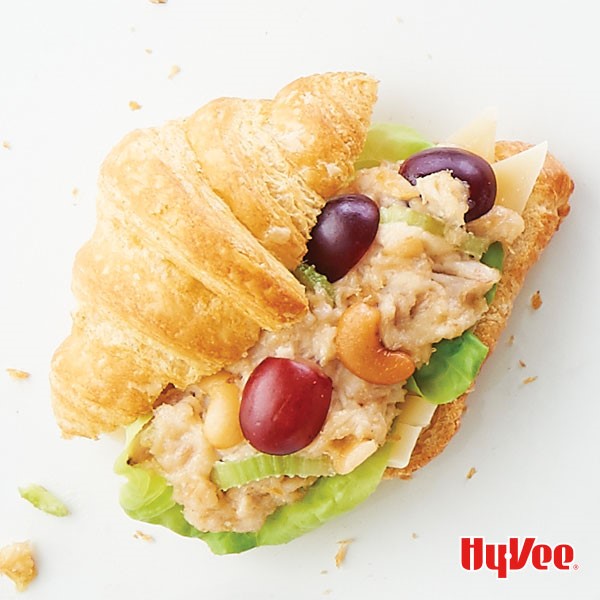 Cashew chicken salad sandwiched between a croissant