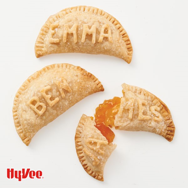 Apricot hand pies with names shaped out of crust 