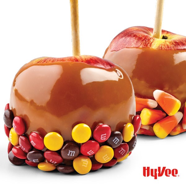 Caramel apples covered in candies such as M&M's and candy corn