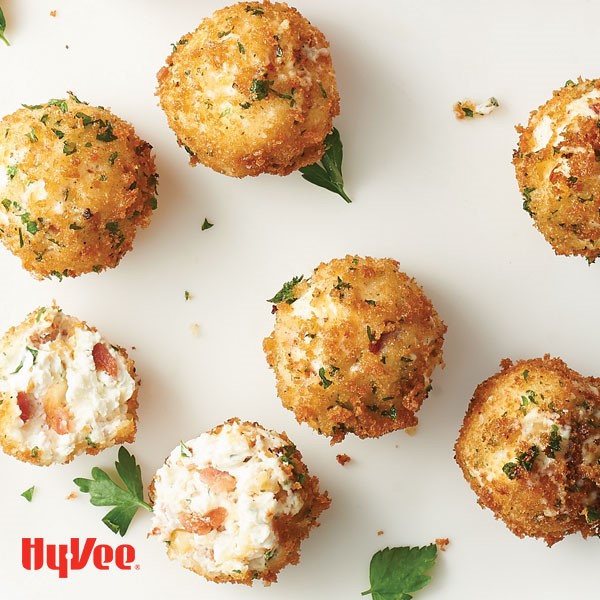 Breaded creamy cheddar balls packed with bacon and topped with Italian parsley