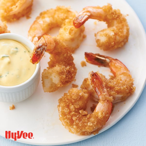 Plate of crispy rice shrimp served with a side bowl of spicy mango dip
