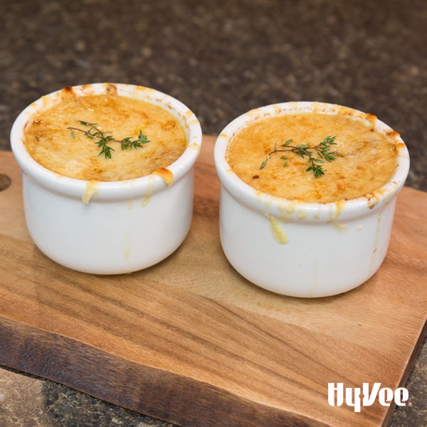 Bowls of Chef Andrew's french onion soup garnished with fresh thyme