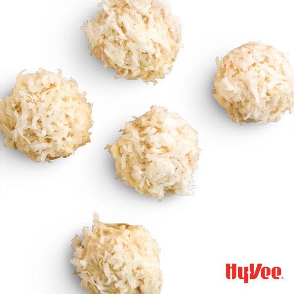 Coconut-flavored cookies dipped in white chocolate and sprinkled with shredded coconut