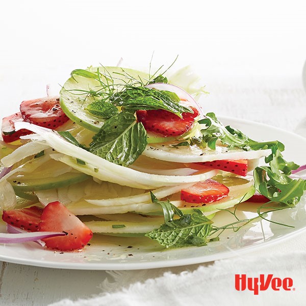 Plate of apple, fennel and strawberry layered salad
