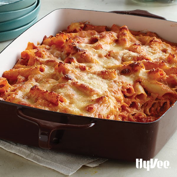 Pan of creamy baked ziti covered in melted mozzarella