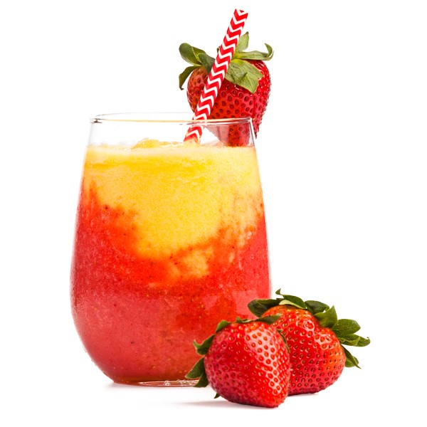 Glass of a strawberry-pineapple wine slushee, garnished with whole strawberries and a straw