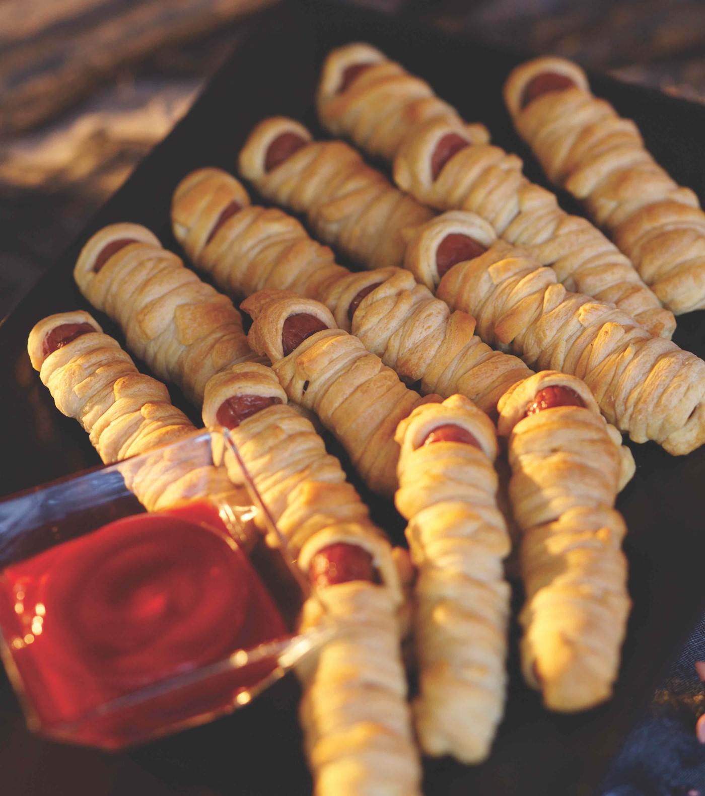 Hot Dogs Wrapped in Thin Pieces of Dough and Baked to Golden Brown