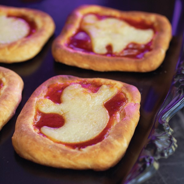 Small Square Pizzas with a Cheese Ghost Placed on top