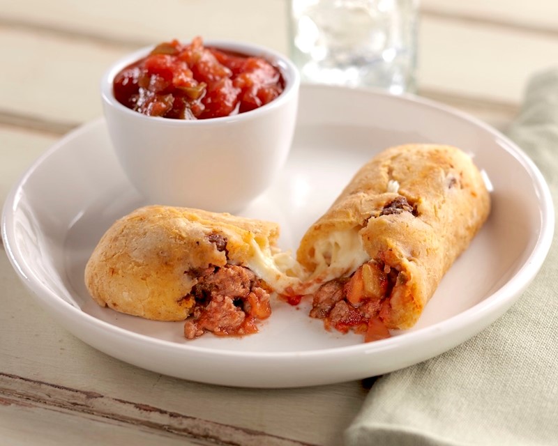 Gluten-Free Taco-Stuffed Bread Sticks Split open with a Cup of Salsa on the Side