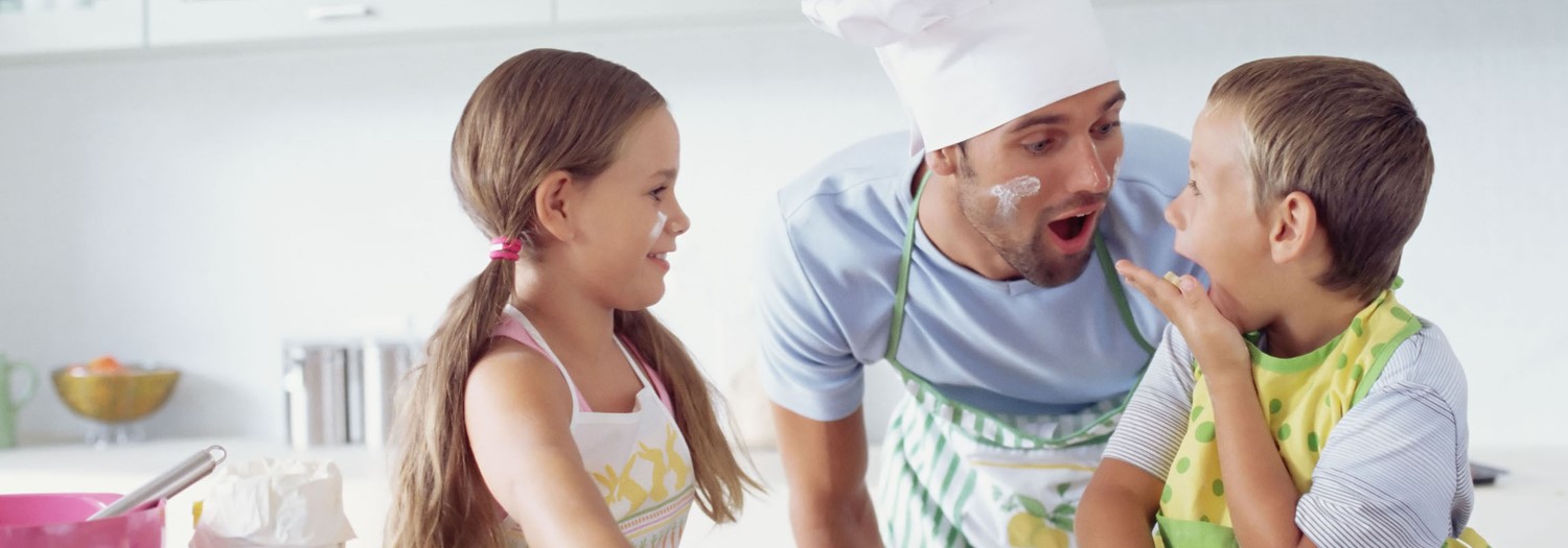 Children in Kitchen with Father