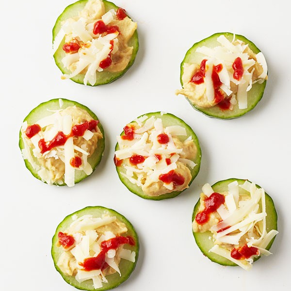 Cucumber Slices with Hummus, Cheese, and Sriracha