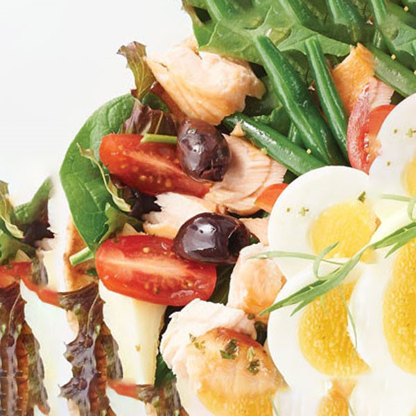 Nicoise Olives with Spring Greens, Tomatoes, and Hard Boiled Egg Slices