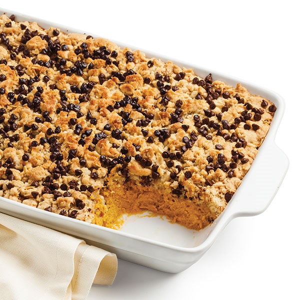 9x13 baking dish with a serving missing and mini chocolate chips on top