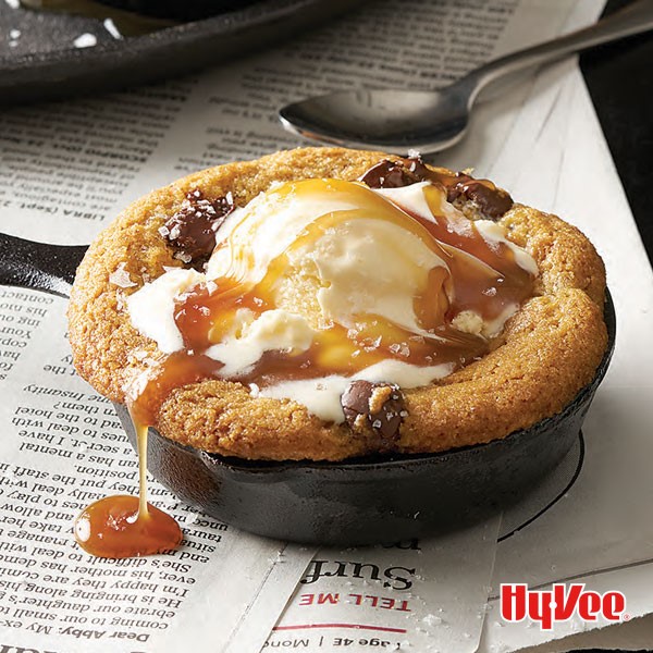 Chocolate chip cookie with caramel and ice cream in mini cast-iron pan