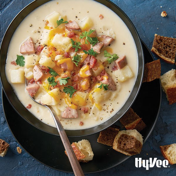 Potato soup with kielbasa sausage and cheese in bowl