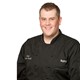 Chef Andrew in black Hy-Vee chef's coat
